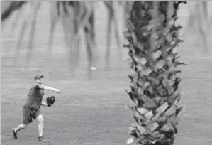  ?? By Matt Slocum, AP ?? Rally time: Jonathan Papelbon, throwing during a workout with the Phillies in Clearwater, Fla., said he expected his previous team, the Red Sox, to come back strong after going 7- 20 to finish last season.