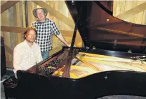  ?? PHOTO: LOUISE SCOTT ?? Piano project . . . Pianist Jonathan Crayford sits at a 1955 Steinway D concert grand piano which he played in Queenstown at the weekend. Beside him is Brett Mills, who paid for the piano.