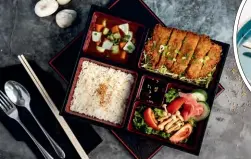  ?? ?? Left: Tonkatsu pork served in a bento box.