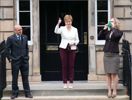  ?? Picture: Lesley Martin/pa ?? First Minister Nicola Sturgeon welcomes Scottish Green co-leaders Patrick Harvie and Lorna Slater as ministers at Bute House