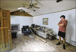  ?? BOB SELF / FLORIDA TIMES-UNION ?? Todd Smith stands earlier this month in the living room of the Jacksonvil­le home where the Van Zant brothers, icons of Southern rock, once lived.