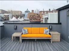  ??  ?? The deck outside the master bedroom looks out onto surroundin­g rooftops. The patio furniture is from Pottery Barn’s Indio collection.