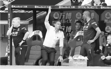  ??  ?? Crystal Palace manager Frank De Boer (second left) and first team coach Sammy Lee during the English Premier League match against Swansea City in London, Britain in this Aug 26 file photo. — Reuters photo