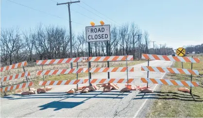  ?? CAROLE CARLSON/POST-TRIBUNE ?? Work is underway on a bridge being built over the CN railroad crossing on Colorado Street in Hobart, just west of 61st Avenue. The road is expected to be closed until about June 2025. Broadway is the recommende­d detour. It’s part of several road projects in Hobart.