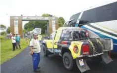  ??  ?? LUQUE: A worker mans the entrance to a Dakar Rally technical checkpoint in Luque, Paraguay, Wednesday. Paraguay is one of three South American hosting the 2017 Dakar Rally with the first stage beginning today, in Asuncion. —AP