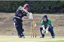  ??  ?? Bryn Llewellyn makes sweet contact with the Banks Umbrellas. ball for the George