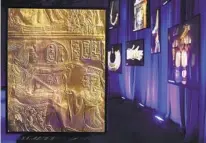  ?? JULIA NIKHINSON AP ?? Photos of artifacts found in King Tut's tomb are displayed at the King Tut Immersive Experience in October in New York.