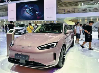  ?? LI FUSHENG / CHINA DAILY ?? Seres showcases the AITO M5 at the Chengdu auto show in August.