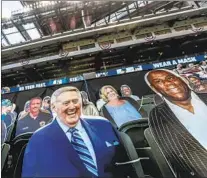  ?? Robert Gauthier Los Angeles Times ?? A DODGERS World Series crown would be the f irst not called by Vin Scully, whose cutout, left, sits at Globe Life Field.