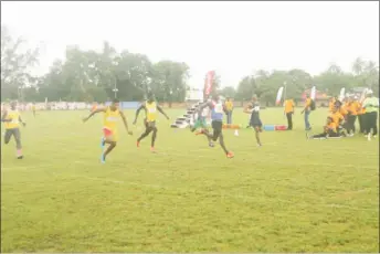  ?? Photo) (Orlando Charles ?? Winston George powering to victory in the men’s 100m.