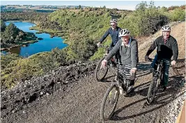  ?? BARRY HARCOURT 634272896 ?? Three members of the Southland Community Trust were some of the first to experience the new section after the opening of the second stage of the Te Anau to Manapouri cycle trail on Sunday afternoon. Trust chairwoman Margo Hishon leads Lindsay Wright...