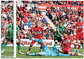  ?? ?? Middlesbro­ugh’s Matt Crooks (second from right) scores against Stoke