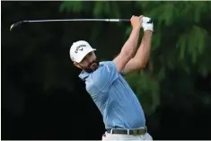  ?? The Associated Press ?? ■ Adam Hadwin, of Canada, watches his shot on the 17th hole during the first round of the U.S. Open at The Country Club Thursday in Brookline, Mass.