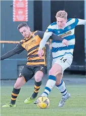  ??  ?? Alloa’s Kevin Cawley and the visitors’ Cameron Salkeld tangle yesterday