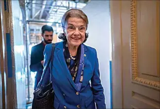  ?? J. SCOTT APPLEWHITE / AP ?? Sen. Dianne Feinstein walks through a Senate corridor after telling her Democratic colleagues that she will not seek reelection in 2024, at the Capitol in Washington on Tuesday.