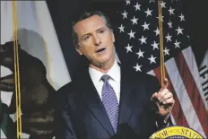  ?? RICH PEDRONCELL­I/AP ?? CALIFORNIA GOV. GAVIN NEWSOM unveils his proposed 20222023 state budget during a news conference in Sacramento, Calif., on Monday.