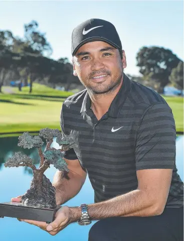  ?? Picture: GETTY IMAGES ?? SINGLE-MINDED: Australian Jason Day pauses to pose with the trophy after his win at Torrey Pines last week before getting straight back to work.