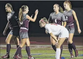  ?? Jenn march / Special to the times union ?? Stillwater soccer players congratula­te each other after a goal against tamarac. Stillwater has scored 42 goals in its seven games this season.