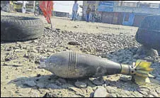  ?? HT PHOTO ?? An unexploded shell fired by Pakistan Rangers lies in a village in RS Pura sector of Jammu district.