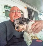  ?? PROVIDED BY RON PACKARD ?? Dominic with owner Ron Packard two weeks before the 5-year-old cavachon died. The dog had recently started wearing a collar.