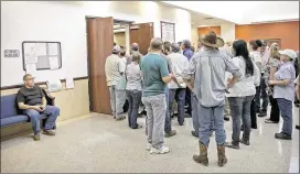  ?? PHOTOS BY JAY JANNER / AMERICAN-STATESMAN ?? The hearing on the Jade Helm 15 training exercise drew an overflow crowd to the Bastrop County Commission­ers Court.