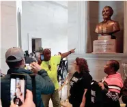  ?? THE TENNESSEAN LARRY MCCORMACK / ?? Protesters demand the removal of a bust of Nathan Bedford Forrest during the first day of the state legislatur­e in Nashville on Jan. 14.