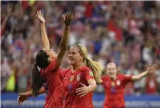  ?? GETTY IMAGES ?? COMING TOGETHER: Lindsey Horan (right) celebrates with Christen Press, who scored in the United States’ semifinal victory against England.