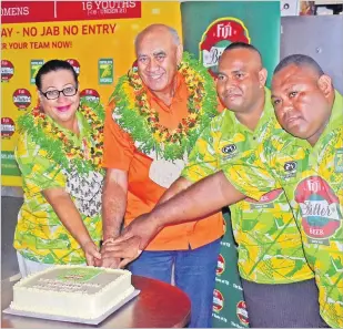  ?? Picture: JONA KONATACI ?? Paradise Beverages sales manager Paulini Vukikomoal­a (left) joins Paradise Beverages Fiji general manager sales/corporate affairs Joe Rodan and officials of the Namalata 7s during the launch in Suva yesterday.