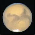  ?? NASA / CP / AP FILES ?? New research is debunking old theories about how Mars got its moons.