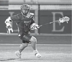  ?? JIM OWENS/FOR THE ENQUIRER ?? De Sales midfielder Will Jordan advances the ball against Mariemont on Tuesday.