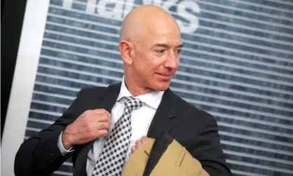  ??  ?? Jeff Bezos has said he supports raising the corporate tax rate. But Amazon has long been the subject of protests about tax avoidance. Photograph: Geisler-Fotopress GmbH/Alamy