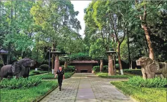  ?? HUANG LERAN / FOR CHINA DAILY ?? A path lined with stone statues of civil officials and animals leads to the mausoleum of Wang Jian (847-918), the founder of the Former Shu Kingdom (907-925).