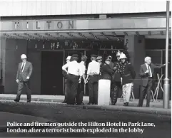  ??  ?? Police and firemen outside the Hilton Hotel in Park Lane, London after a terrorist bomb exploded in the lobby