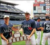  ?? BOB RAINES — DIGITAL FIRST MEDIA ?? Andrew Mayhew, left, and Luke Nuneviller takes their turn holding the Carpenter Cup Championsh­ip trophy on Friday.