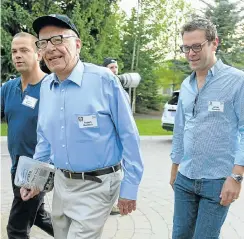  ?? Picture: Getty Images ?? News Corporatio­n executive chairman Rupert Murdoch is flanked by sons and heirs Lachlan and James.