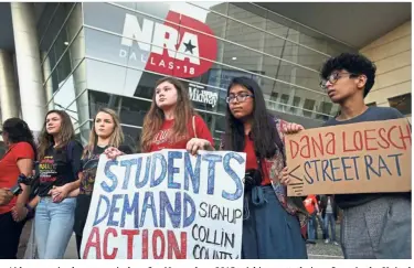  ??  ?? Not backing down: Activists demonstrat­ing at the NRA’s convention in Dallas.— AFP