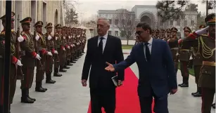  ?? (Phil Stewart/Reuters) ?? US DEFENSE SECRETARY Jim Mattis is escorted into the Afghan presidenti­al palace in Kabul yesterday during an unannounce­d visit to the country.