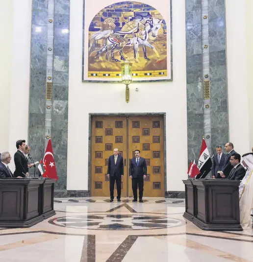  ?? ?? President Recep Tayyip Erdoğan (L) and Iraq’s Prime Minister Mohammed S. Al Sudani attend the signing of the “Developmen­t Road” framework agreement on security, economy and developmen­t, Baghdad, Iraq, April 22, 2024.