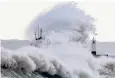  ??  ?? Storm Ellen sends waves crashing over the harbour wall in Porthcawl, South Wales