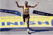  ?? Charles Krupa/Associated Press ?? Sisay Lemma, of Ethiopia, breaks the tape to win the Boston Marathon Monday in Boston.