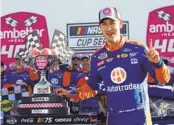  ?? BUTCH DILL AP ?? Joey Logano celebrates in victory lane after winning the Ambetter Health 400 in Hampton, Ga., Sunday.