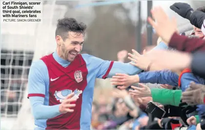  ?? PICTURE: SIMON GREENER ?? Carl Finnigan, scorer of South Shields’ third goal, celebrates with Mariners fans