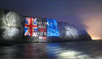  ?? Tim P. Whitby/Getty Images for Sky UK ?? Sky News marks Brexit day by projecting a farewell message on the white cliffs of Dover on Friday in Dover, England.