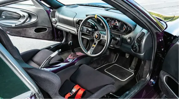  ??  ?? 996 cabin is compact by modern 911 standards. Centre console delete a popular modificati­on, for that GT3 vibe