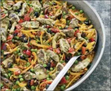  ?? CARL TREMBLAY — AMERICA’S TEST KITCHEN VIA AP ?? This undated photo provided by America’s Test Kitchen in May 2018 shows vegetable paella in Brookline, Mass. This recipe appears in “The Complete Mediterran­ean Cookbook.”