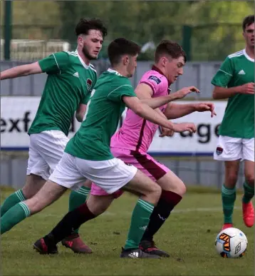  ??  ?? Danny Doyle of Wexford F.C. is outnumbere­d by Cork City duo Rory Doyle and Dale Holland.