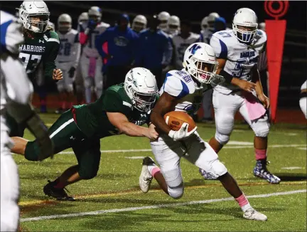 ?? MEDIANEWS GROUP FILE PHOTO ?? Norristown’s Zion Malone, right, is tackled from behind by Methacton’s Dan Meier last season.