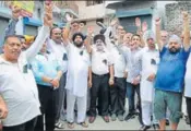  ??  ?? Traders protesting against the new tax slabs in Jalandhar on Friday. The fraternity is worried about procedures and penalties. HT PHOTO