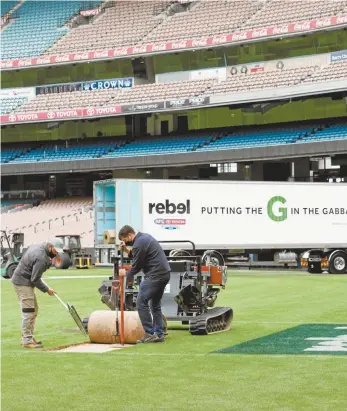  ?? MCG ?? Ground staff at the Melbourne Cricket Ground last week removed a section of turf from the goal square, which was then transporte­d to Brisbane and laid at the Gabba ahead of today’s AFL grand final.
