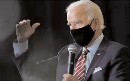  ?? TheAssocia­tedPress ?? Joe Biden speaks while wearing a mask at a campaign stop, Thursday. U.S. President Donald Trump seldom wears a mask in public.